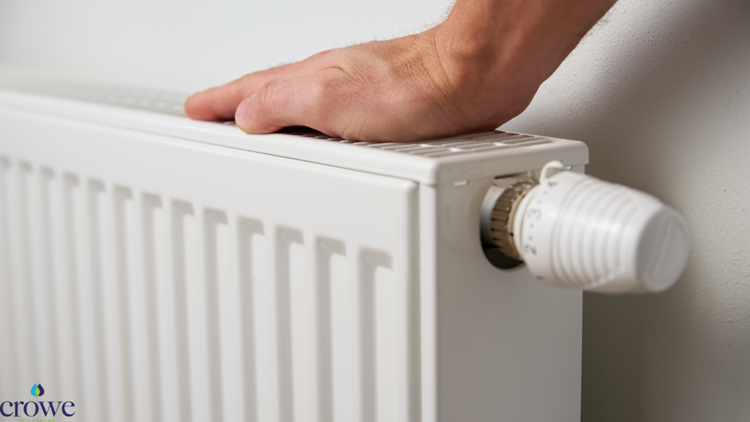 corner of a radiator with a hand on it